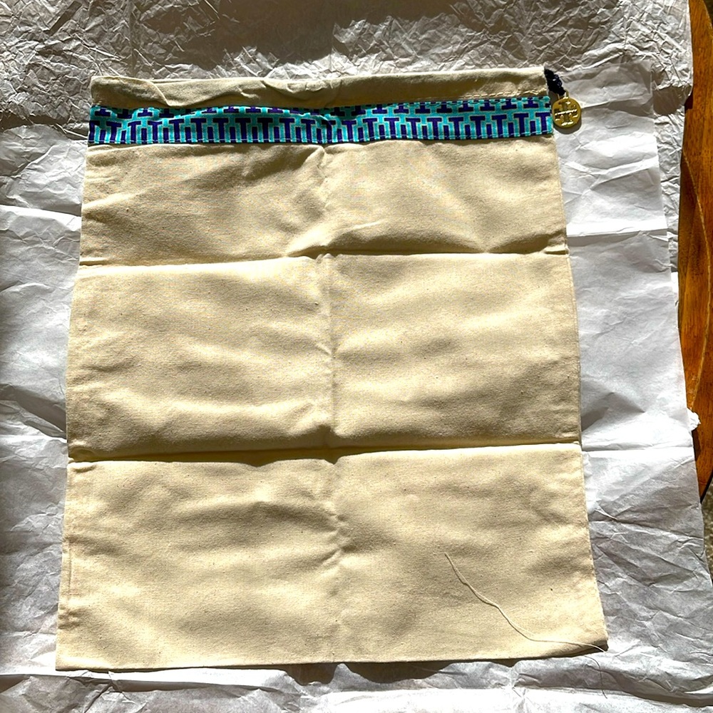 Drawstring dust bag by Tory Burch.